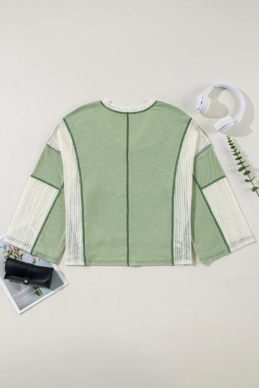Gum Leaf lace trim contrast V-neck long sleeve blouse, flat lay with long lace side panels