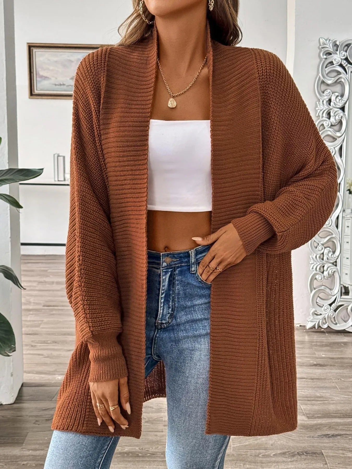 Brown oversized knit cardigan with open front, long sleeves, textured weave, hip length