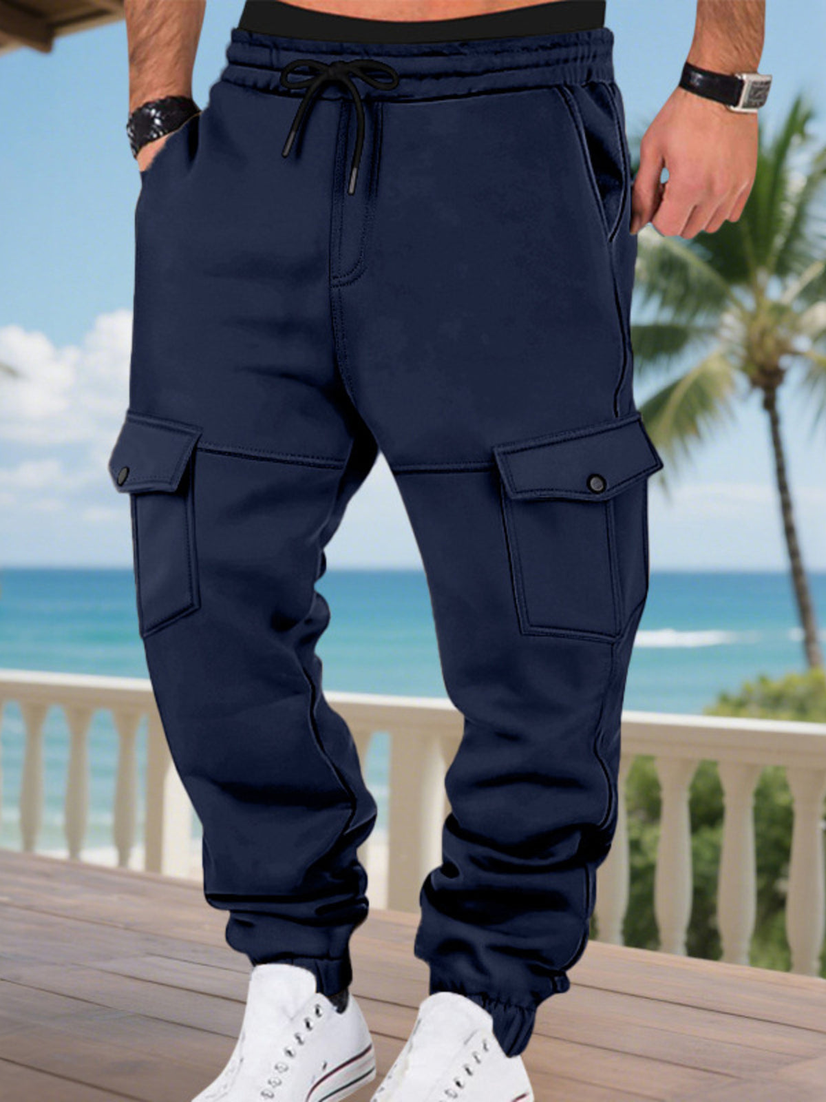 Men's navy cargo jogger pants with drawstring waist and flap cargo pockets